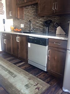 Rustic Alder Kitchen Cabinets with Mission Oak Stain and a Tile Backsplash